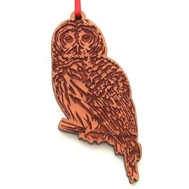 Nestled Pine Ornament|Barred Owl|Brook Trout|Great Blue Heron in Flight|Howling Wolf|Lake Sturgeon|Monarch Butterfly|Moose|Muskie|Sea Turtle R|Sea Turtle S|Black Bear|Cowboy Hat|Dragonfly|Mustang|Orca|Rainbow Trout|Salmon|Sasquatch|Tarpon|Triggerfish|Griz